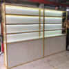 Tủ kệ trưng bày gỗ MDF trắng khung mạ vàng